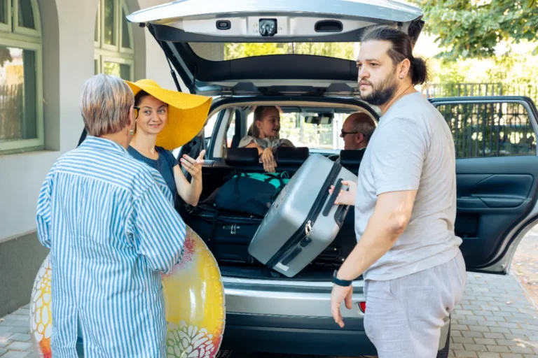 A family on the car ready to go to a vacation.