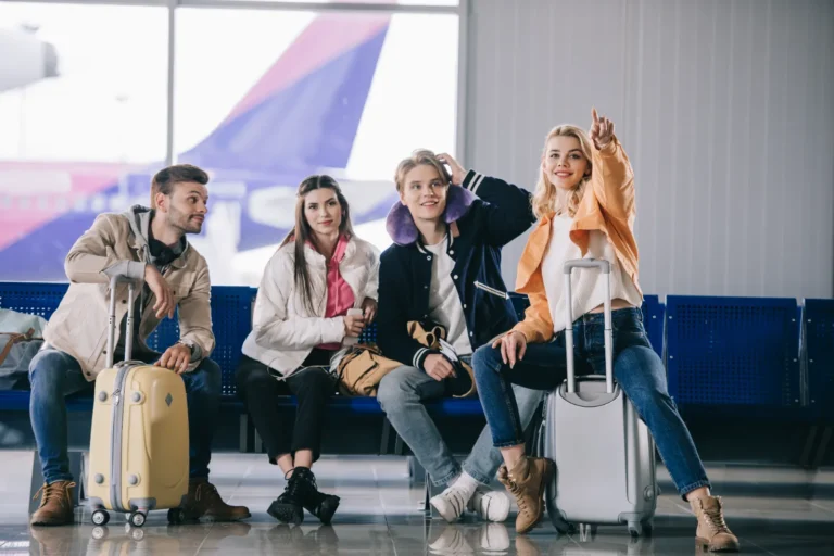 A young travelers being excited to pick-up on the airport.